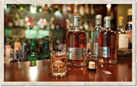 Bottles of Bainbridge Organic Distillers spirits on bar